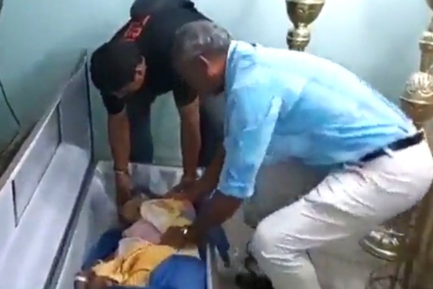 சவப்பெட்டியிலிருந்து சத்தம் - பெட்டியைத் தட்டி உயிருடன் வந்த மூதாட்டி